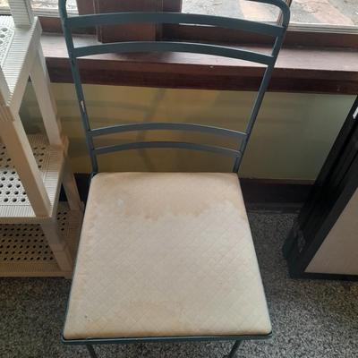 Plastic storage shelving with Vintage iron framed chair