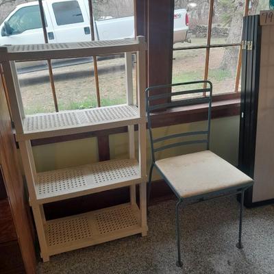 Plastic storage shelving with Vintage iron framed chair