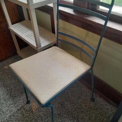 Plastic storage shelving with Vintage iron framed chair