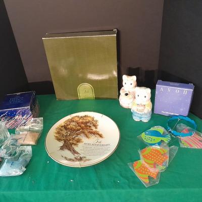 New in the box Avon Collectables, fish wind chime, Cat themed serving pieces, plate, and Wax candle maker