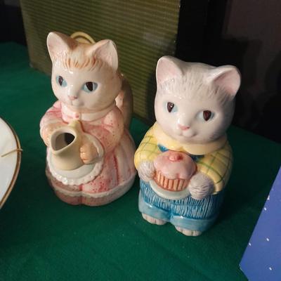 New in the box Avon Collectables, fish wind chime, Cat themed serving pieces, plate, and Wax candle maker