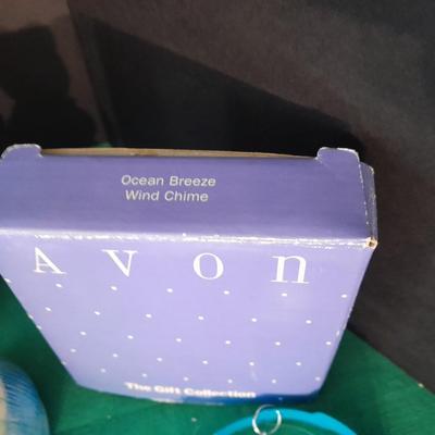 New in the box Avon Collectables, fish wind chime, Cat themed serving pieces, plate, and Wax candle maker