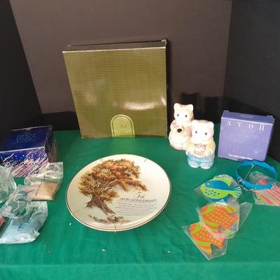 New in the box Avon Collectables, fish wind chime, Cat themed serving pieces, plate, and Wax candle maker