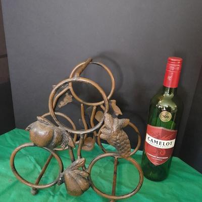Tabletop Iron wine rack with Wine glasses and empty bottle