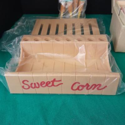 Unique sweet corn cob butter and holders and a Vintage roll of soft tissue
