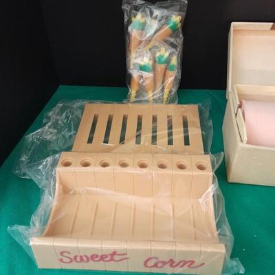 Unique sweet corn cob butter and holders and a Vintage roll of soft tissue