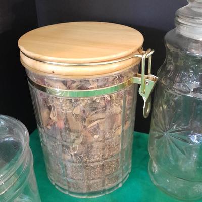 Glass lidded canisters and an oil / vinegar canister set with metal hanging rack