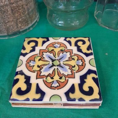 Glass lidded canisters and an oil / vinegar canister set with metal hanging rack