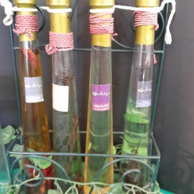 Glass lidded canisters and an oil / vinegar canister set with metal hanging rack