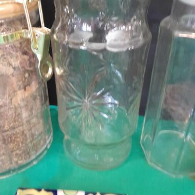 Glass lidded canisters and an oil / vinegar canister set with metal hanging rack