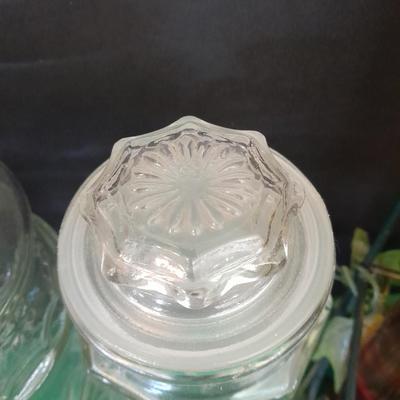 Glass lidded canisters and an oil / vinegar canister set with metal hanging rack