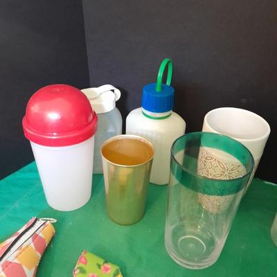 Assortment of plastic kitchen cups, and beverage coozie's