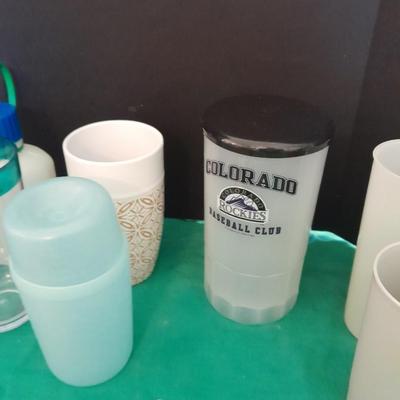 Assortment of plastic kitchen cups, and beverage coozie's