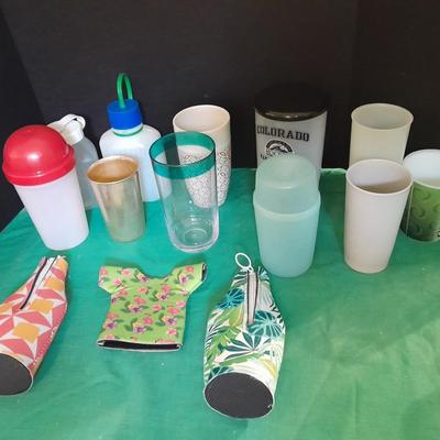 Assortment of plastic kitchen cups, and beverage coozie's