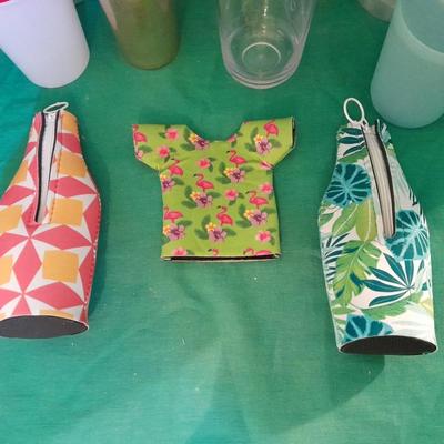 Assortment of plastic kitchen cups, and beverage coozie's
