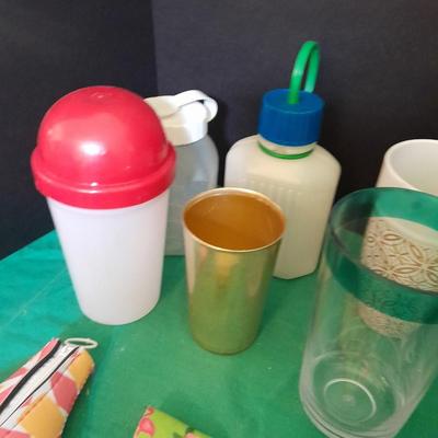 Assortment of plastic kitchen cups, and beverage coozie's