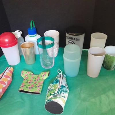 Assortment of plastic kitchen cups, and beverage coozie's
