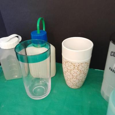Assortment of plastic kitchen cups, and beverage coozie's