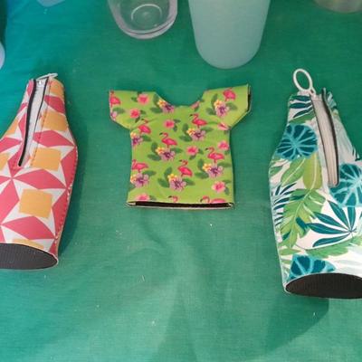 Assortment of plastic kitchen cups, and beverage coozie's