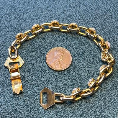 SATINY WHITE STONES IN GOLD TONE CHARM STYLE BRACELET