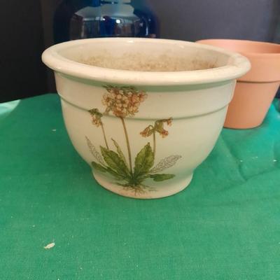 Gardening pots, glass bulb waterers, vase and a springtime chair decoration