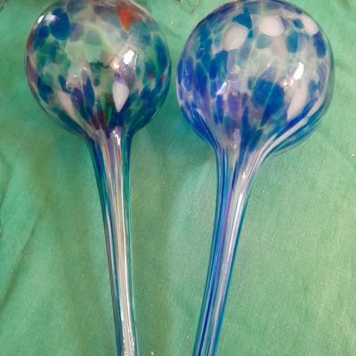 Gardening pots, glass bulb waterers, vase and a springtime chair decoration