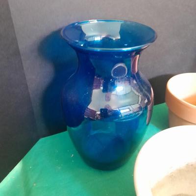 Gardening pots, glass bulb waterers, vase and a springtime chair decoration