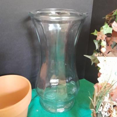 Gardening pots, glass bulb waterers, vase and a springtime chair decoration