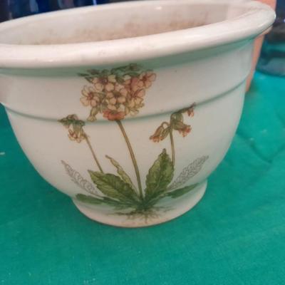 Gardening pots, glass bulb waterers, vase and a springtime chair decoration