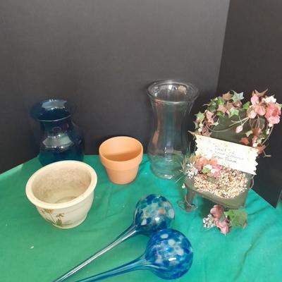 Gardening pots, glass bulb waterers, vase and a springtime chair decoration