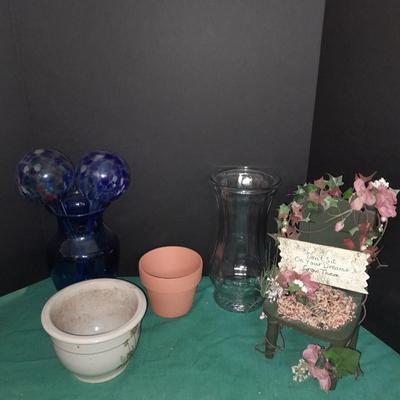 Gardening pots, glass bulb waterers, vase and a springtime chair decoration