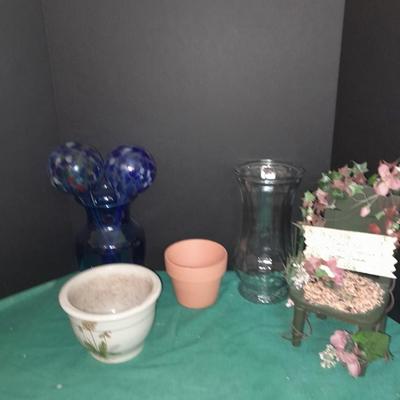 Gardening pots, glass bulb waterers, vase and a springtime chair decoration