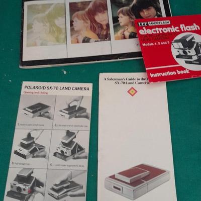 Vintage Polaroid sx-70 Land Camera with flash bulb and original instruction books