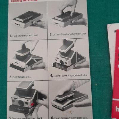 Vintage Polaroid sx-70 Land Camera with flash bulb and original instruction books