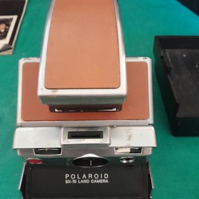 Vintage Polaroid sx-70 Land Camera with flash bulb and original instruction books