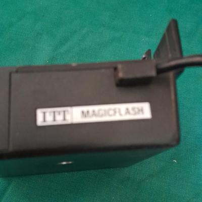 Vintage Polaroid sx-70 Land Camera with flash bulb and original instruction books