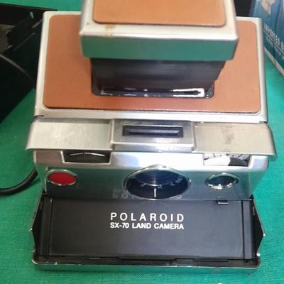 Vintage Polaroid sx-70 Land Camera with flash bulb and original instruction books