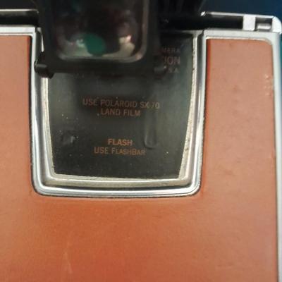 Vintage Polaroid sx-70 Land Camera with flash bulb and original instruction books