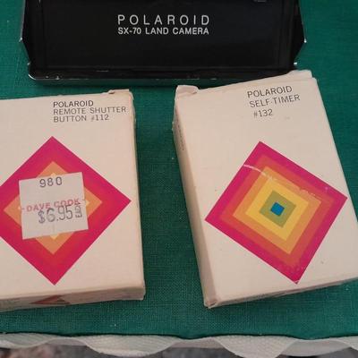 Vintage Polaroid sx-70 Land Camera with flash bulb and original instruction books