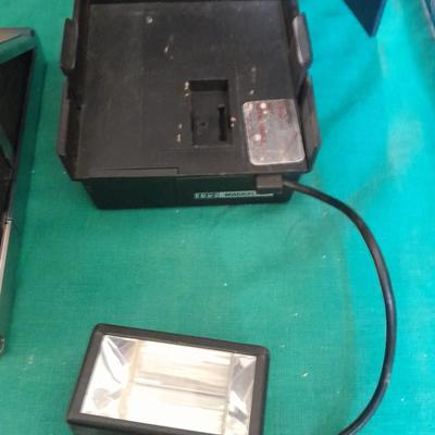 Vintage Polaroid sx-70 Land Camera with flash bulb and original instruction books