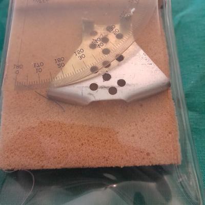 Artist Painting supplies including face painting brushes, Dymo label maker and lidded containers for beads and more