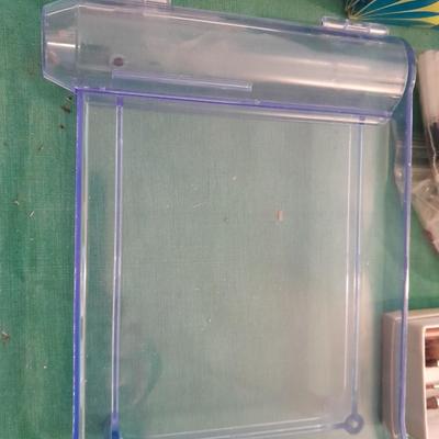 Artist Painting supplies including face painting brushes, Dymo label maker and lidded containers for beads and more