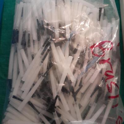 Artist Painting supplies including face painting brushes, Dymo label maker and lidded containers for beads and more