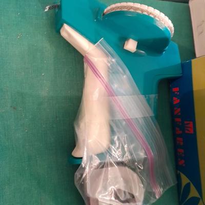 Artist Painting supplies including face painting brushes, Dymo label maker and lidded containers for beads and more