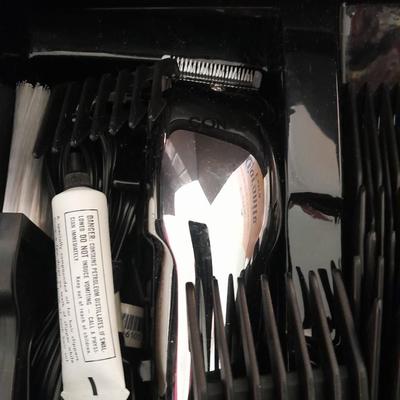 Like new Conair clippers and several make-up / travel bags