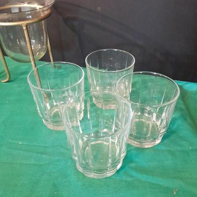 Set of 8 drinking glasses, a candle vase, and a treat dish