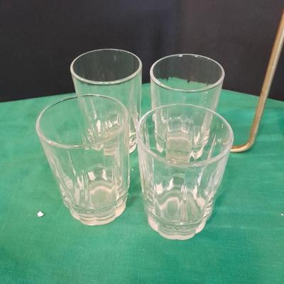 Set of 8 drinking glasses, a candle vase, and a treat dish