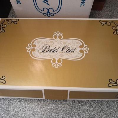 Beautiful, elegant wedding gown size 18 in cardboard storage chest