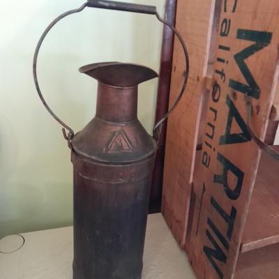 Divided wooden J.D. Martin California crate and tin vase with handle.