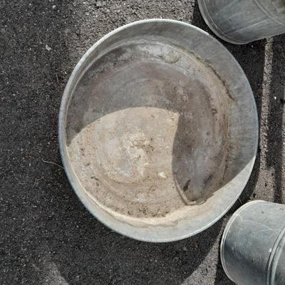 Two galvanized metal buckets and a shallow galvanized dish